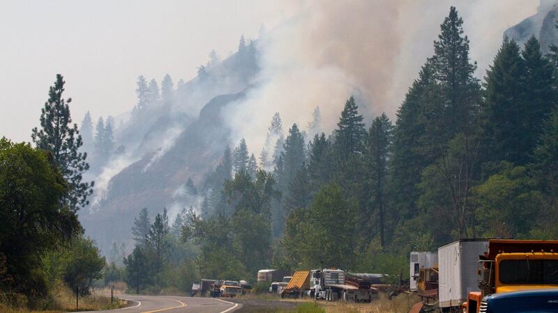 Photos from the Idaho Department of Lands show a large wildfire spreading through northern...