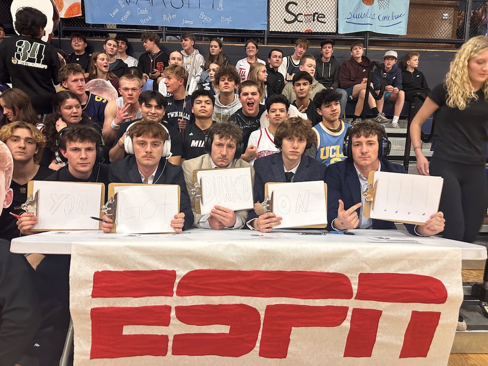 Twin Falls students pose as ESPN analysts during the Great Basin Championship between Minico...