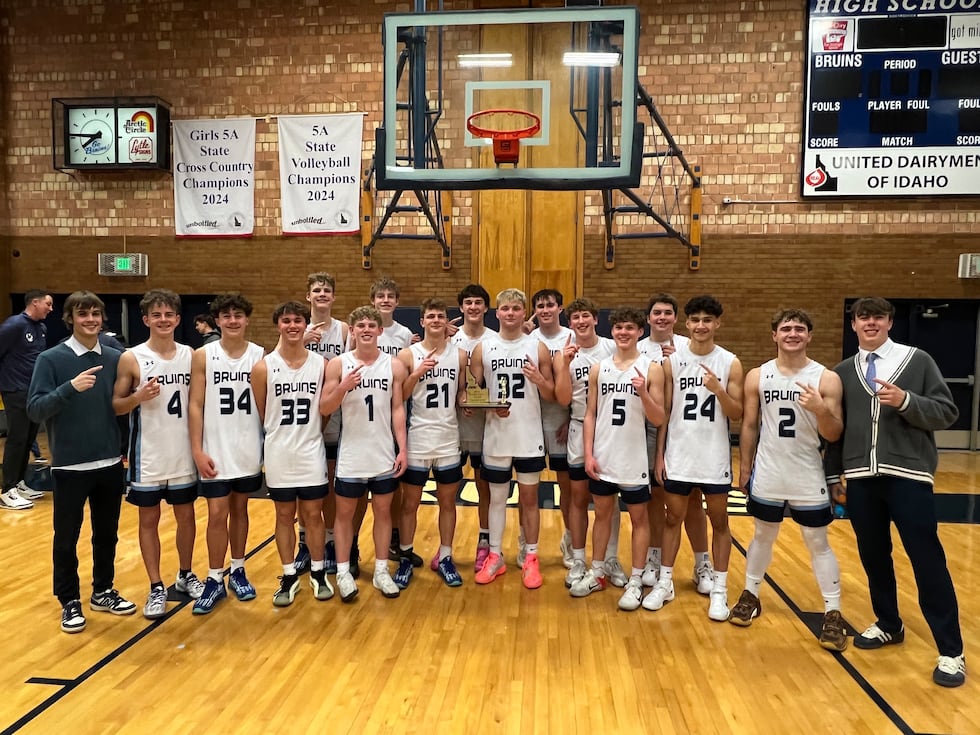 Twin Falls poses with the trophy after beating Minico 51-49 on Wednesday night (Feb. 26, 2025).